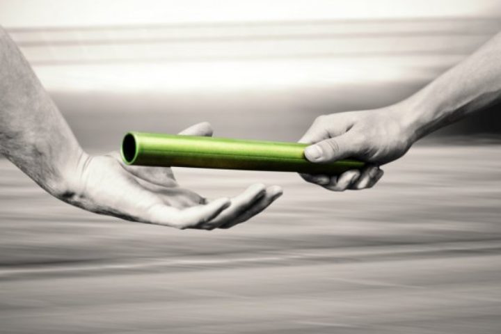 depositphotos_113590584-stock-photo-man-passing-baton-to-partner