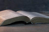 Bible on wooden background
