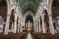 inside-view-church-with-religious-icons-windows-stone-arches-min