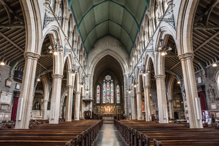 inside-view-church-with-religious-icons-windows-stone-arches-min